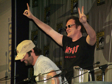 Quentin Tarantino (standing) and Robert Rodriguez (sitting) at Comic-Con International 2006